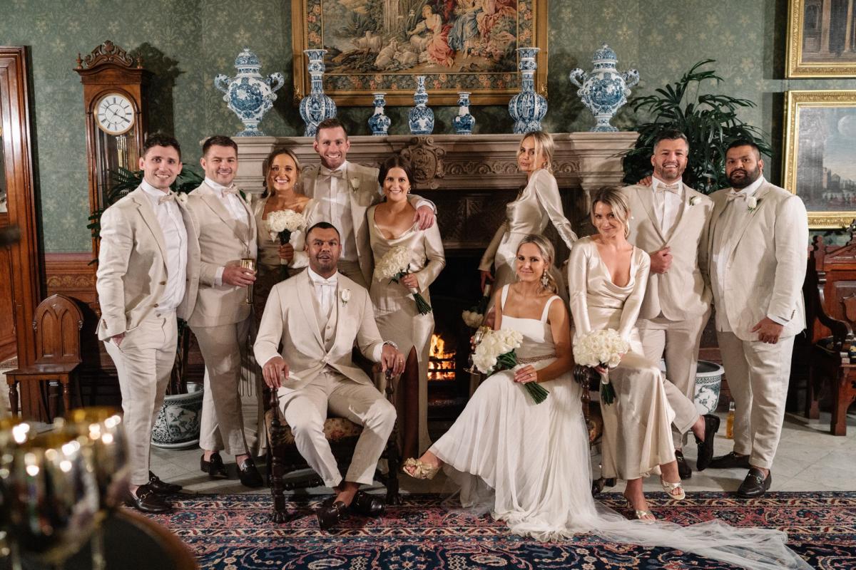 Real bride Maddi with her neutral toned bridal party. wearing the Daisy gown; a non traditional chiffon wedding dress by Karen Willis holmes
