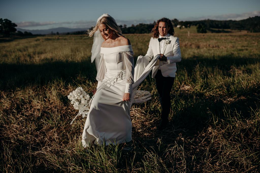 Real bride Hannah wears the Lauren gown; an off shoulder wedding dress with customised Nikki sleeves by Karen Willis Holmes