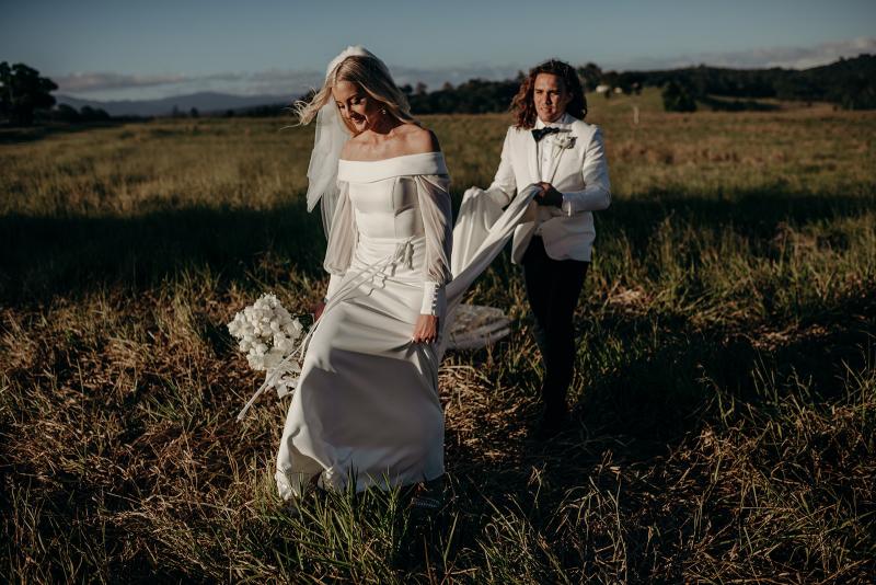 Real bride Hannah wears the Lauren gown; an off shoulder wedding dress with customised Nikki sleeves by Karen Willis Holmes