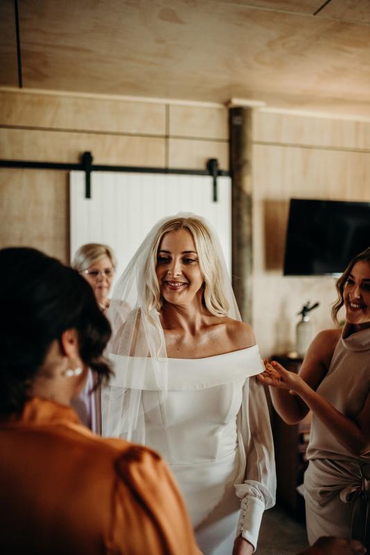 Real bride Hannah getting ready for her real wedding wearing the Lauren gown with Nikki sleeves by Karen Willis Holmes