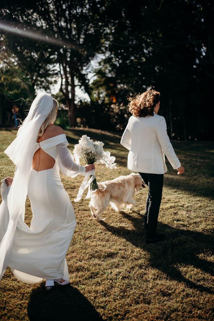 Real bride Hannah wears the Lauren gown with cut open back and off shoulder long sleeves by Karen Willis Holmes