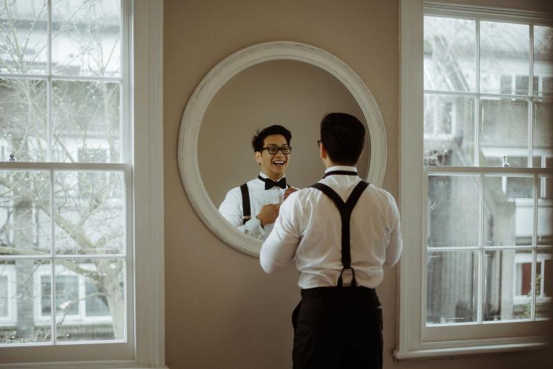 Groom gets ready to wed Karen Willis Holmes bride in timeless tuxedo