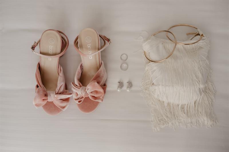 Real bride accessories for KWH bride Leanne, wearing pink bow heels, Amelie George earrings, and a white embellished bag