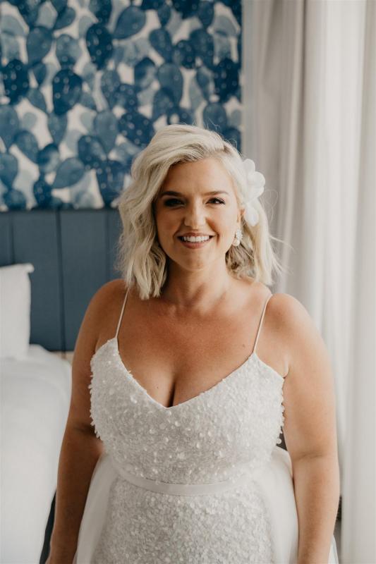 Curvy real bride Leanne wears the Anya gown; a beaded spaghetti strap wedding dress by Karen Willis Holmes.