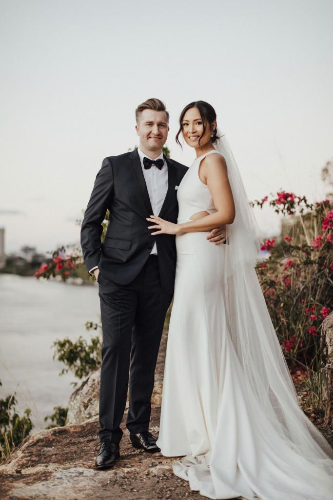 Real bride Melissa wears the Bridget gown to beach wedding, a relaxed casual halter wedding dress by Karen Willis holmes, paired with the KWH Claude Veil; a minimalists bridal veil.