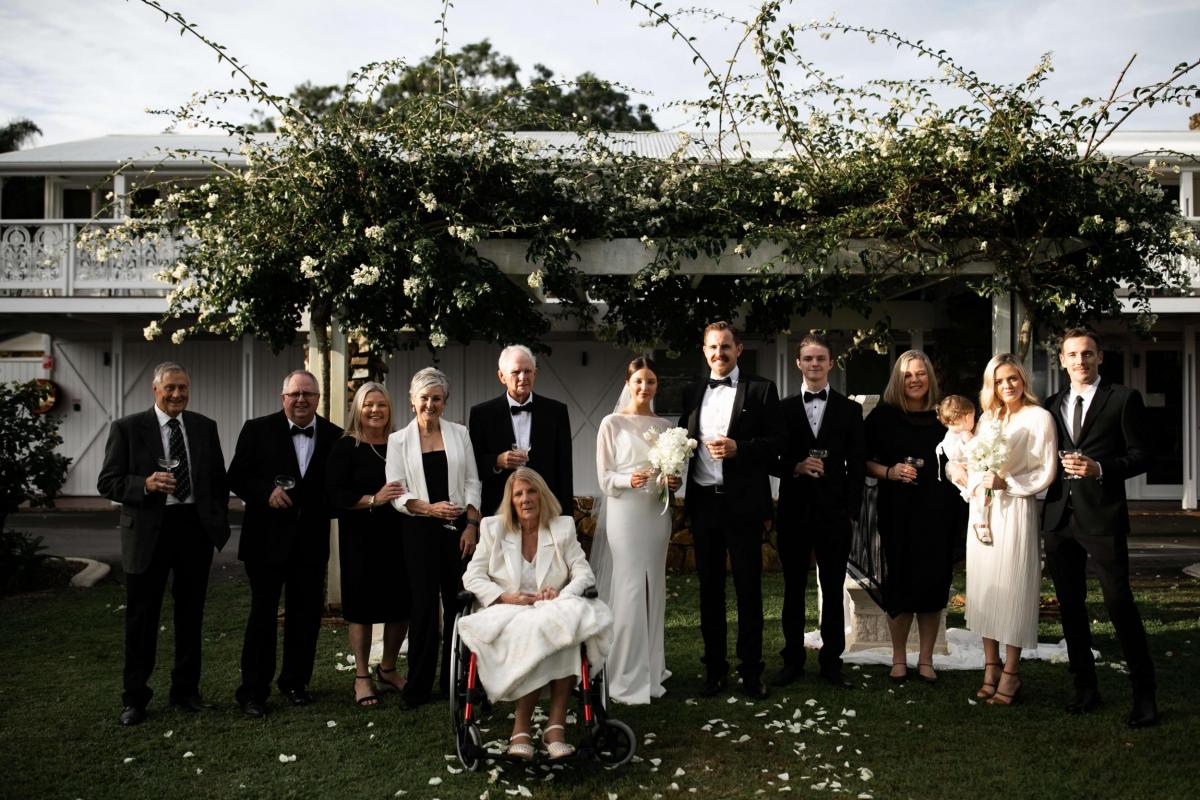 Real bride Elle Costello wears the Brie gown by Karen Willis Holmes, to her small wedding ceremony at Fins Plantation House