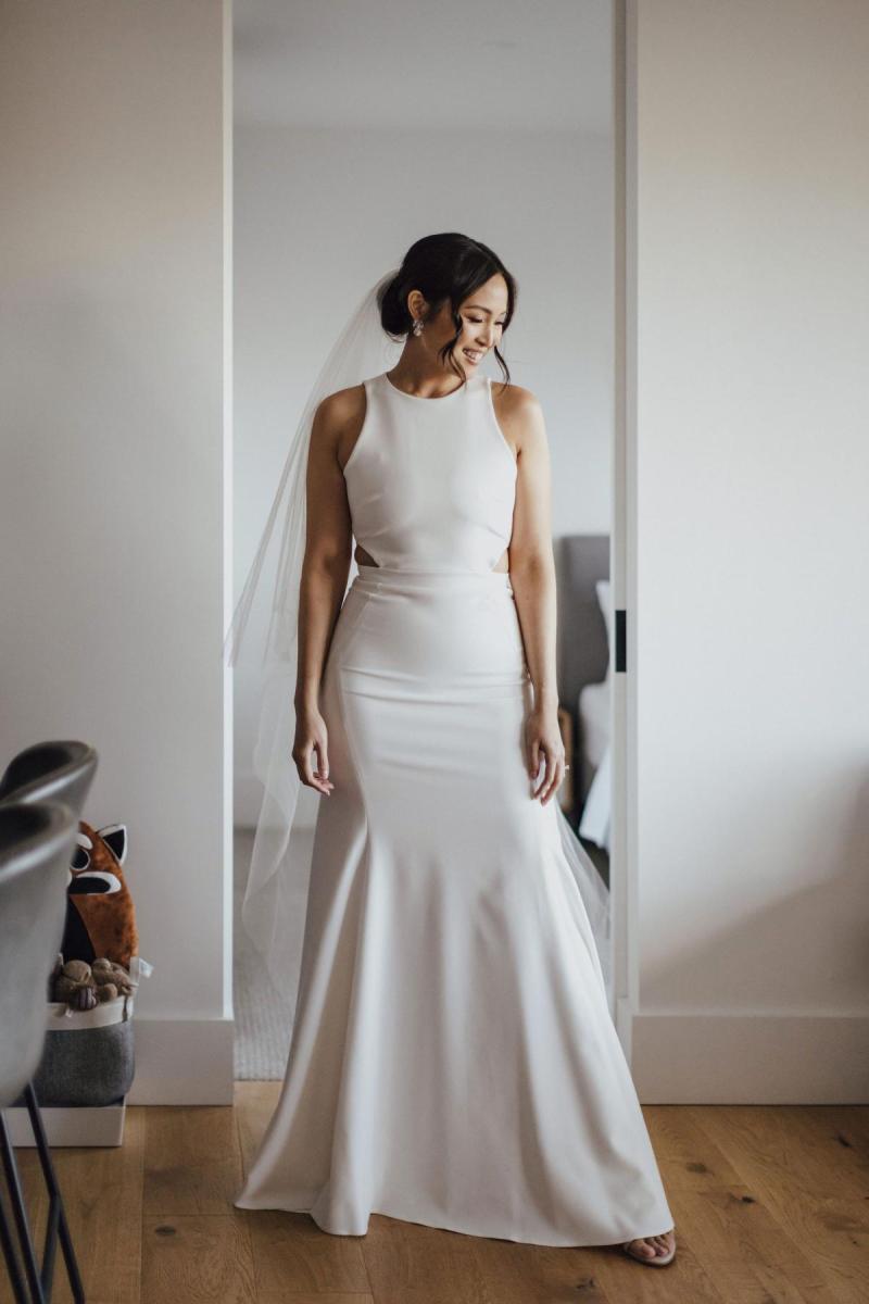 Real bride Melissa getting ready for her small covid wedding, wearing the Bridget gown by Karen Willis Holmes.