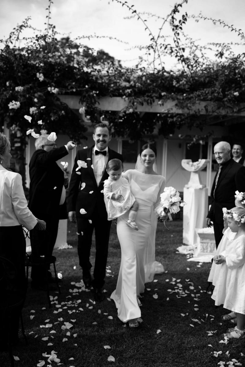 Real bride Elle Costello wears the Brie gown by Karen Willis Holmes, to her small wedding ceremony at Fins Plantation House
