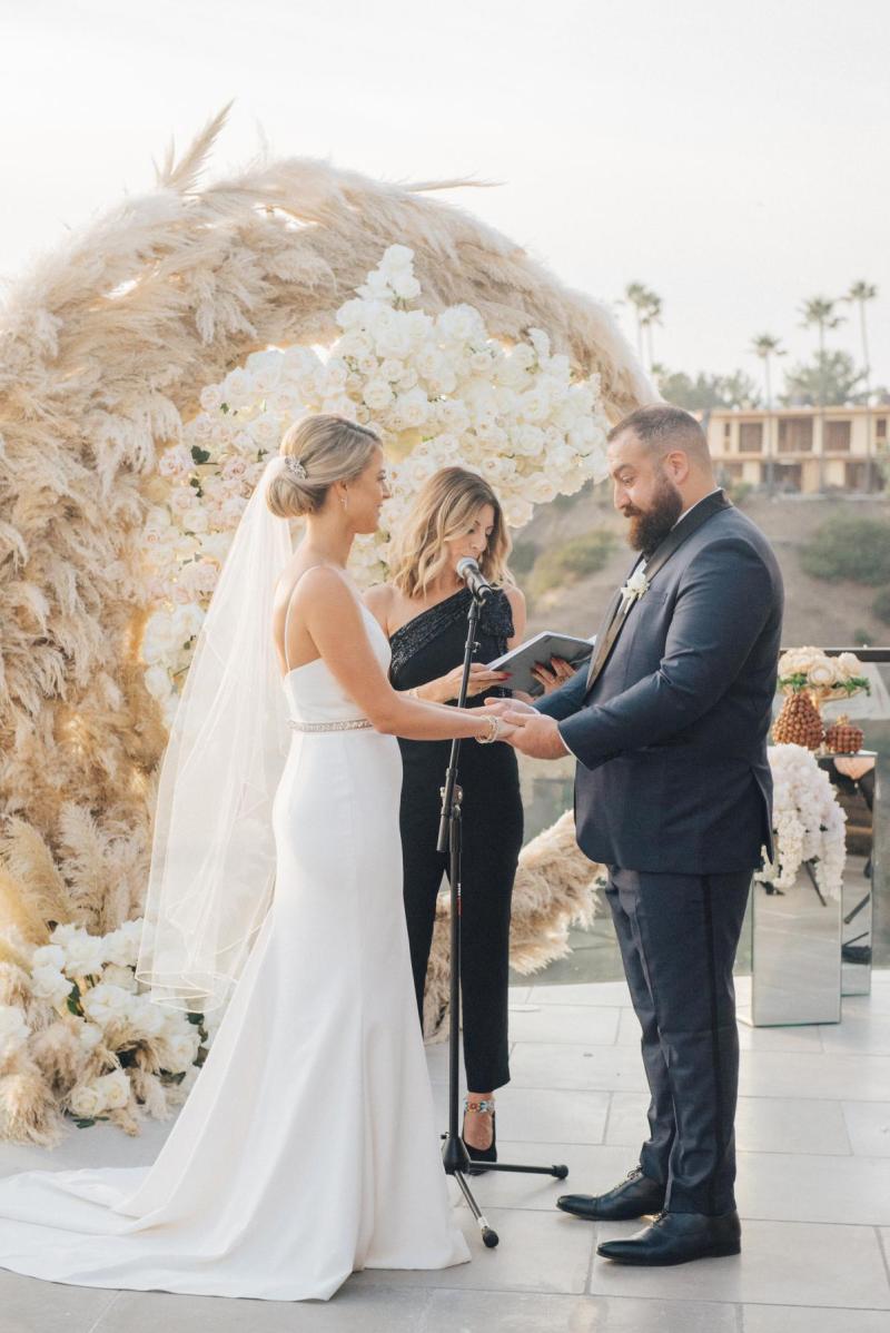 Real bride Noel wears the simple Caroline gown by Karen Willis Holmes to intimate, small wedding in LA