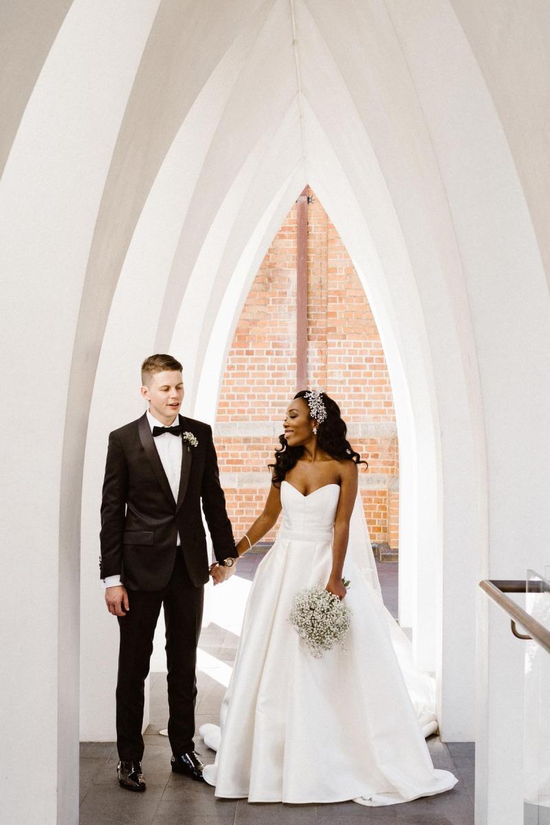 Real bride Ancille wears the Kitty Melanie gown; a traditional ballgown wedding dress from the Bespoke collection by Karen Willis Holmes.