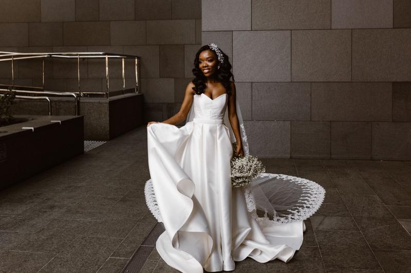Real bride Ancille wears the Kitty Melanie gown; a traditional aline strapless wedding dress from the Bespoke collection by Karen Willis Holmes.