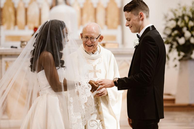 Real bride Ancille getting ready for her church wedding, wearing the Kitty Melanie gown by Karen Willis Holmes with sweetheart neckline.