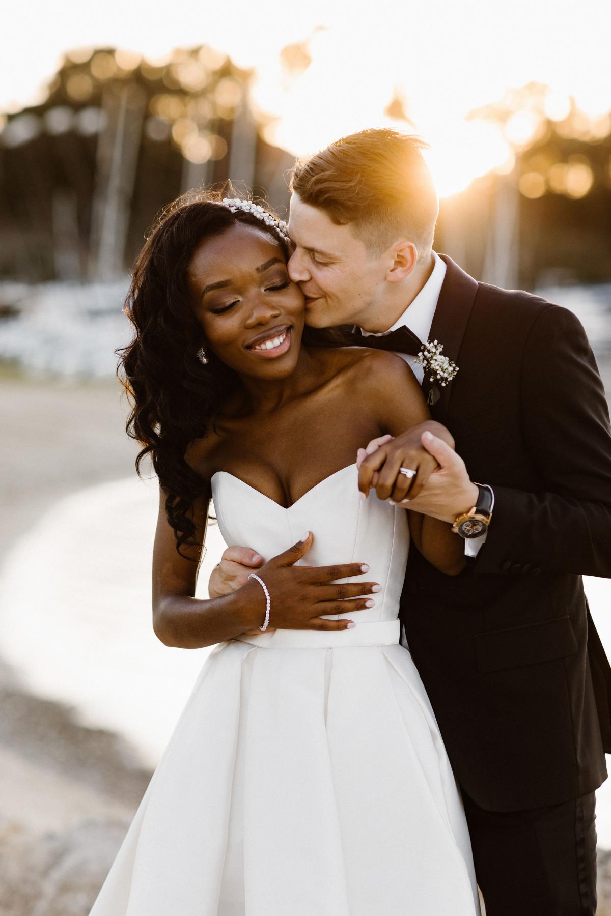 KWH real bride Ancille sways with her husband as she wears the Bespoke Kitty Melanie gown with soft pleats.