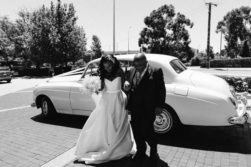 Real bride Ancille getting ready for her church wedding, wearing the Kitty Melanie gown by Karen Willis Holmes with sweetheart neckline.