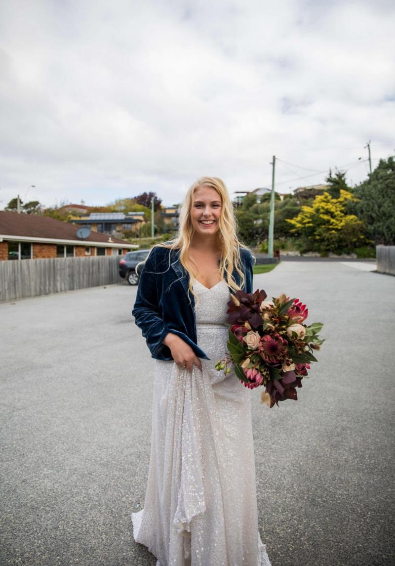 Alana wears the Lotus wedding dress by Karen Willis Holmes to her small COVID-19 wedding