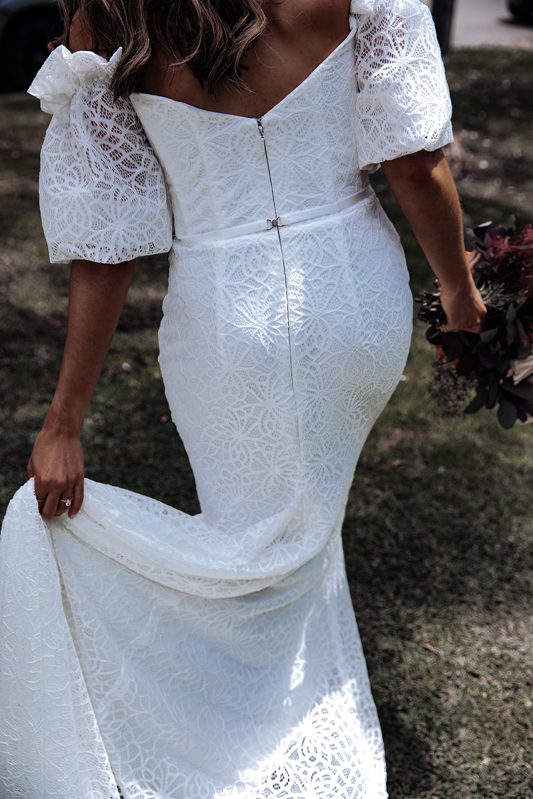 Real bride Zinovia wears the Vivienne gown; a puffy sleeve wedding dress by Karen Willis Holmes.
