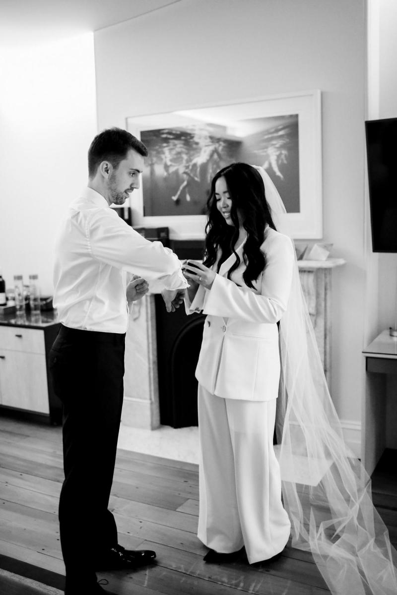 Real bride Nicole at first look with husband Jamie, wearing the Charlie Danielle and a simple veil by Karen Willis Holmes.