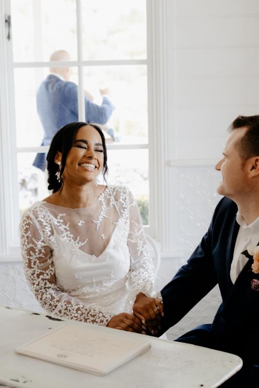 Real bride Saliya wears the Pascale gown, a long sleeve lace wedding dress by Karen Willis Holmes.