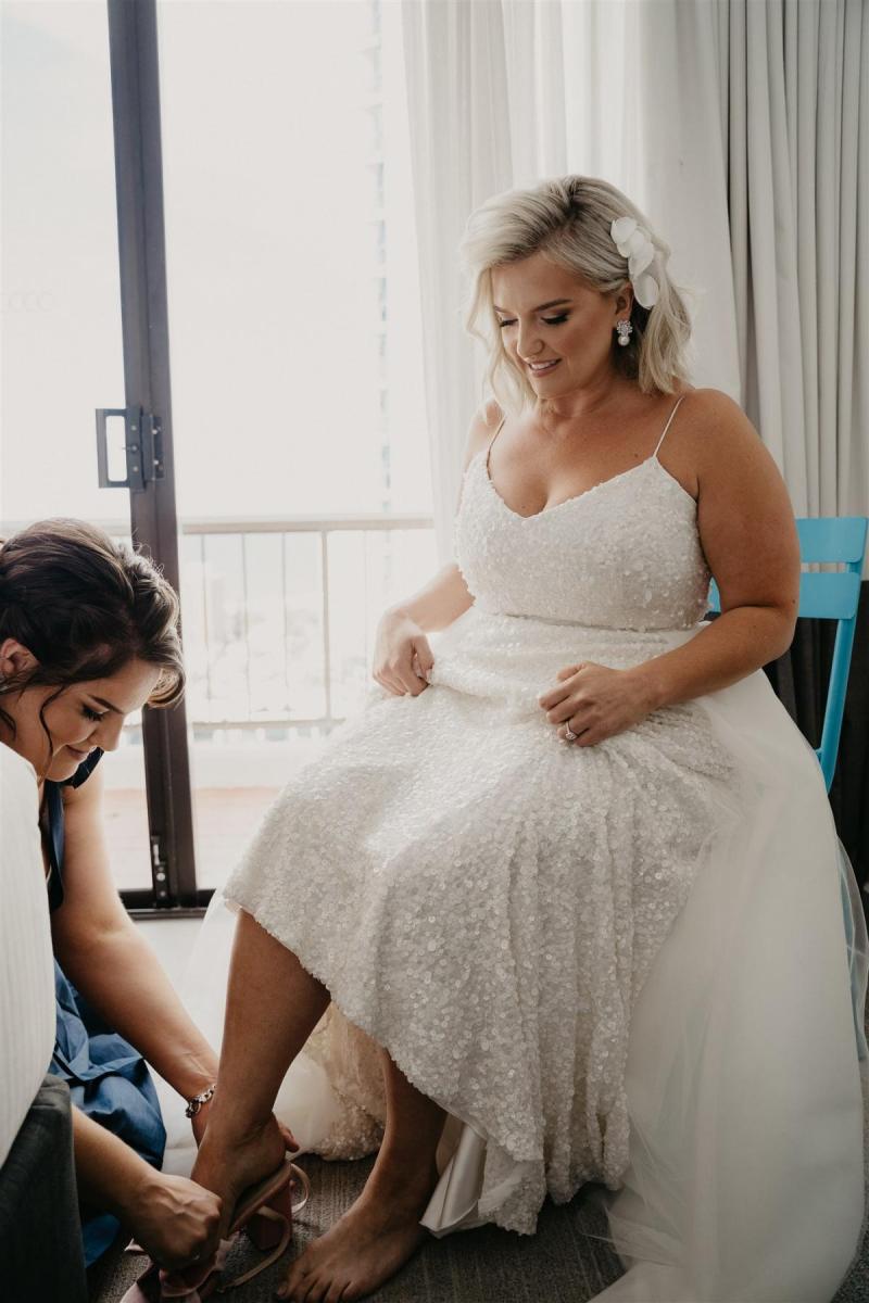 Real bride Leanne getting ready for her wedding, wearing the Anya gown by Karen Willis Holmes.
