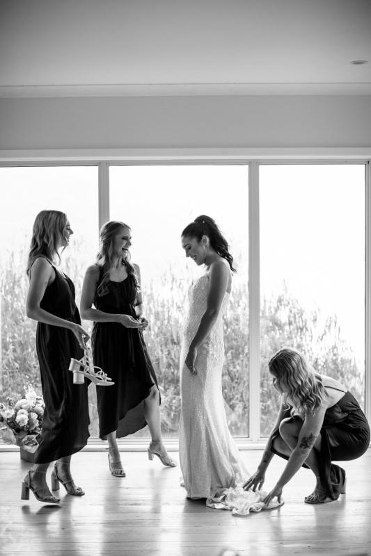 Ruby shows off her beaded Darcy gown from the Luxe collection by Karen Willis Holmes to her bride's maids.