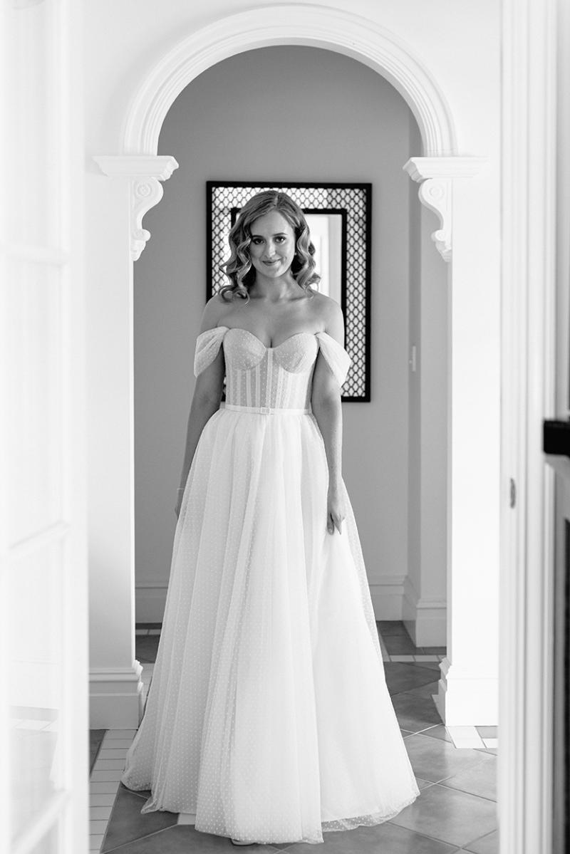 Real bride Jess getting ready for her wedding, wearing the Audrey gown; a polka dot wedding dress by Karen Willis Holmes.