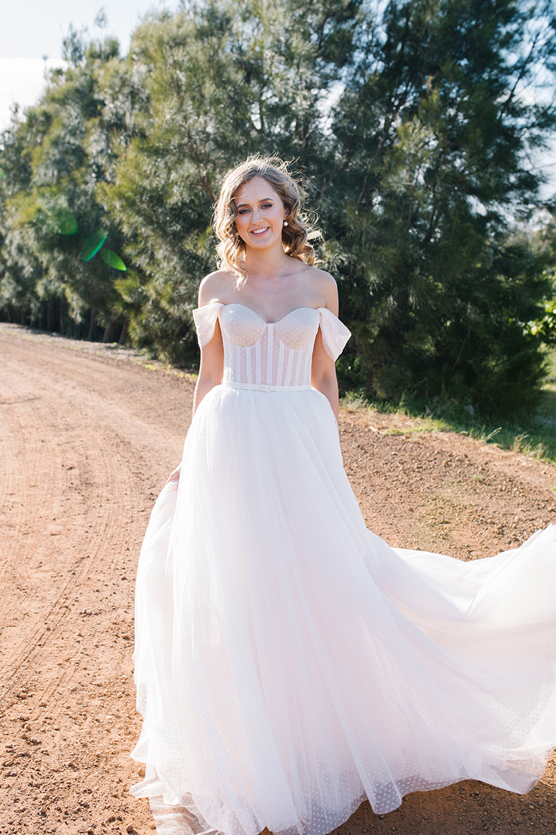 Real bride Jess wearing the Audrey gown; a polka dot wedding dress by Karen Willis Holmes.