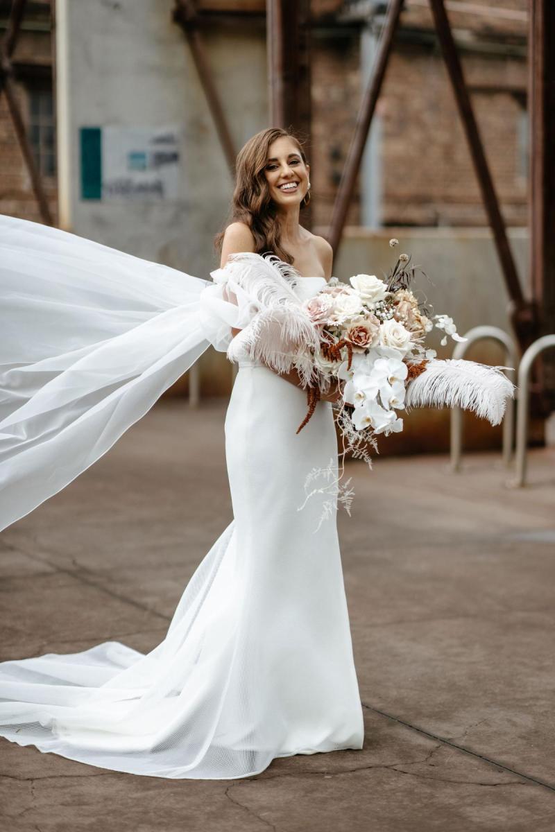 Real bride Belinda wearing the Grace gown and Opera Train; a strapless fitted wedding dress by Karen Willis Holmes.