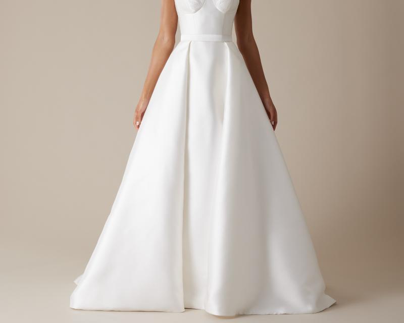 The Elizabeth skirt by Karen Willis Holmes, an A-Line pleated wedding dress skirt with a split with Blake bodice