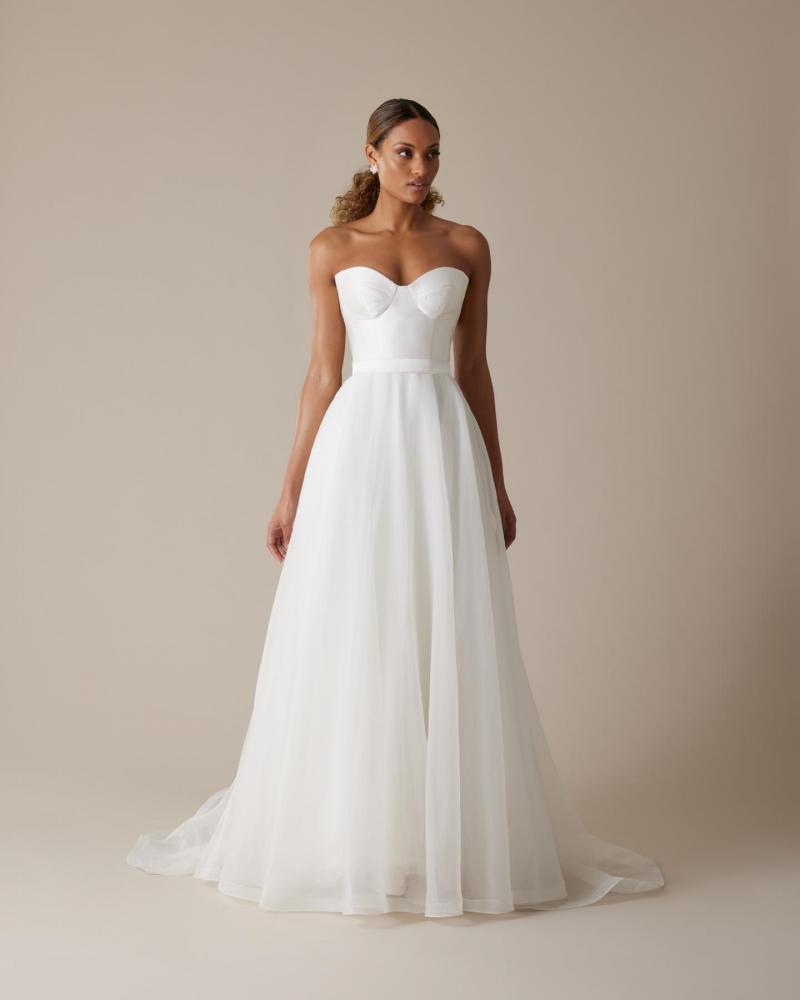 The Blake bodice by Karen Willis Holmes, a simple bustier wedding dress bodice paired with the organza Joni skirt.