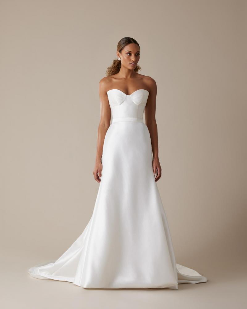 The Blake bodice by Karen Willis Holmes, a simple bustier wedding dress bodice paired with the sheath Karly skirt.