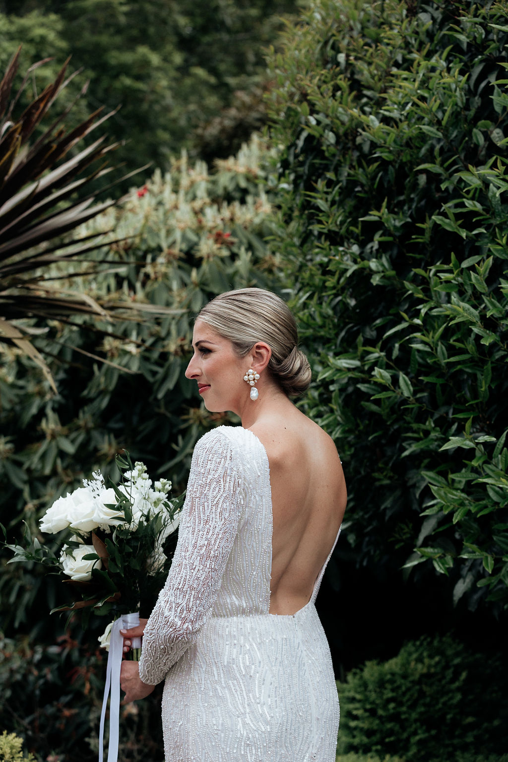 KWH Real bride Hannah wears her modern plunging back Margareta gown with her Christie Nicolaides earrings.