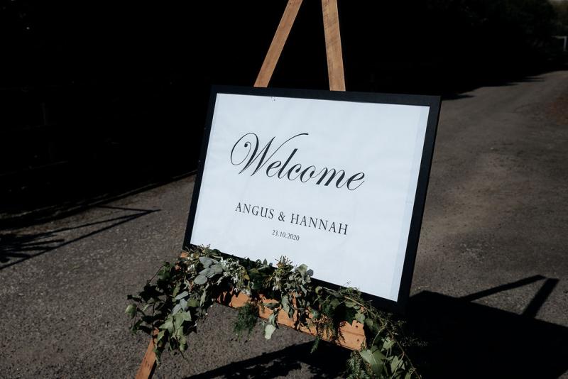 KWH real bride Hannah's welcome sign to the wedding ceremony.