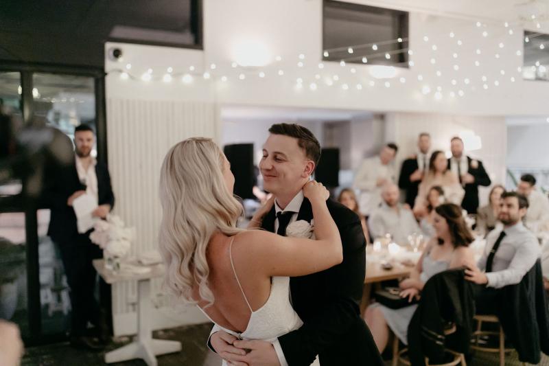 KWH real bride Nicole and Chris dancing sweetly at thier recpetion. She wears the ivory lace Justine gown from the WILD HEARTS collection