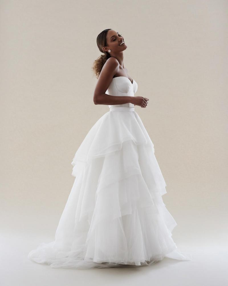 The Blake bodice by Karen Willis Holmes, a simple bustier wedding dress bodice paired with the tiered tulle Marina skirt