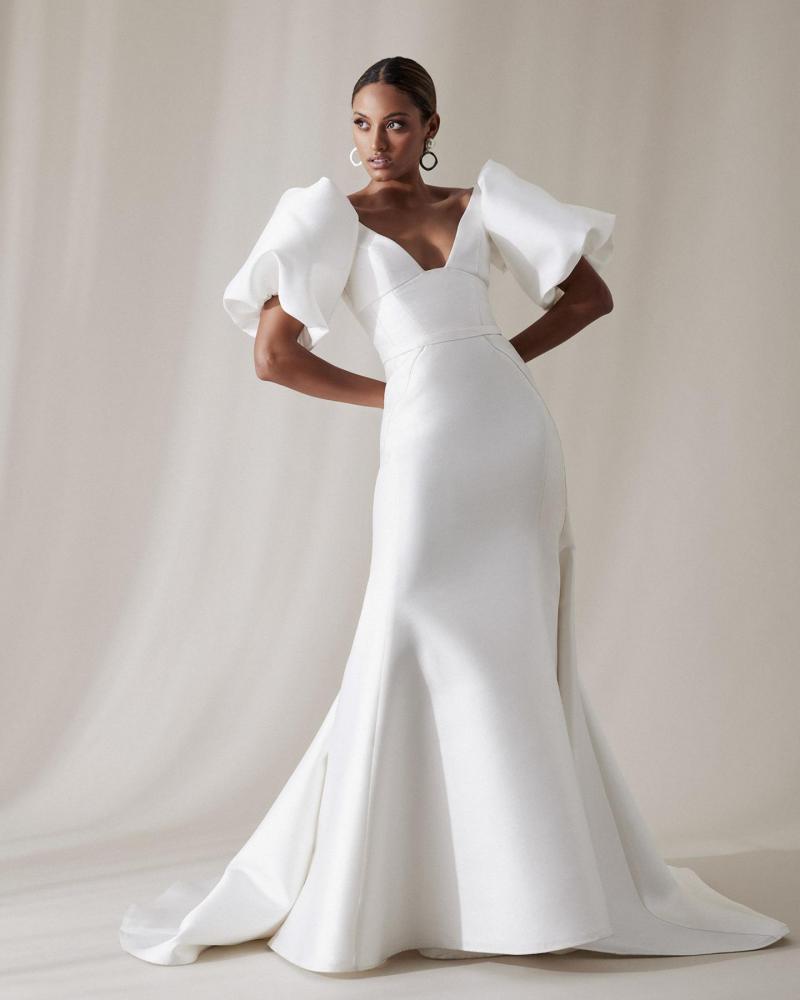 The Taryn bodice by Karen Willis Holmes, a simple, U-neckline wedding dress bodice with straps paired with the classic Alexia skirt and twill Bubble sleeves.