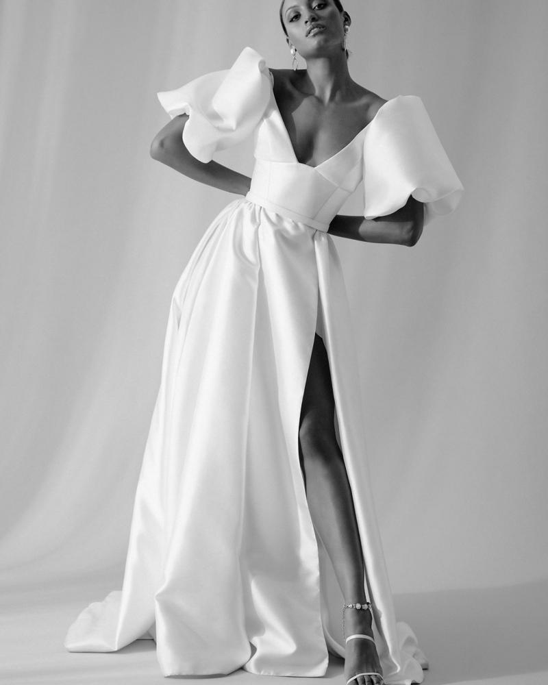 The Taryn bodice by Karen Willis Holmes, a simple, U-neckline wedding dress bodice with straps paired with the daring Camille skirt in this B&W image.