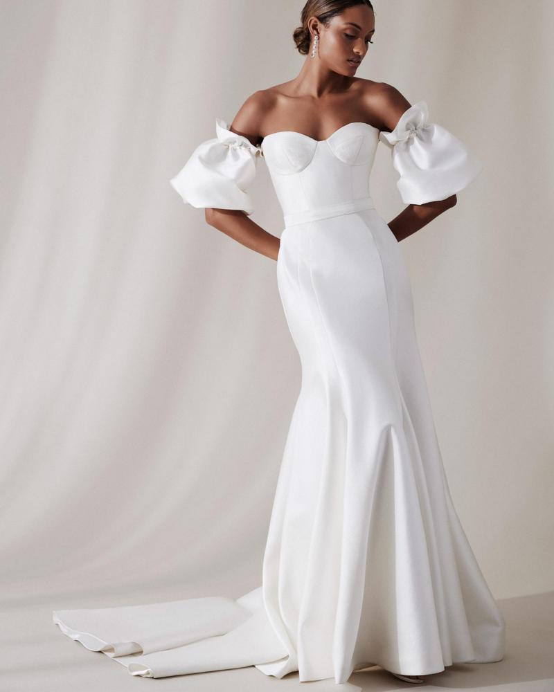 The Blake bodice by Karen Willis Holmes, a simple bustier wedding dress bodice with Puff sleeves and Prea skirt.