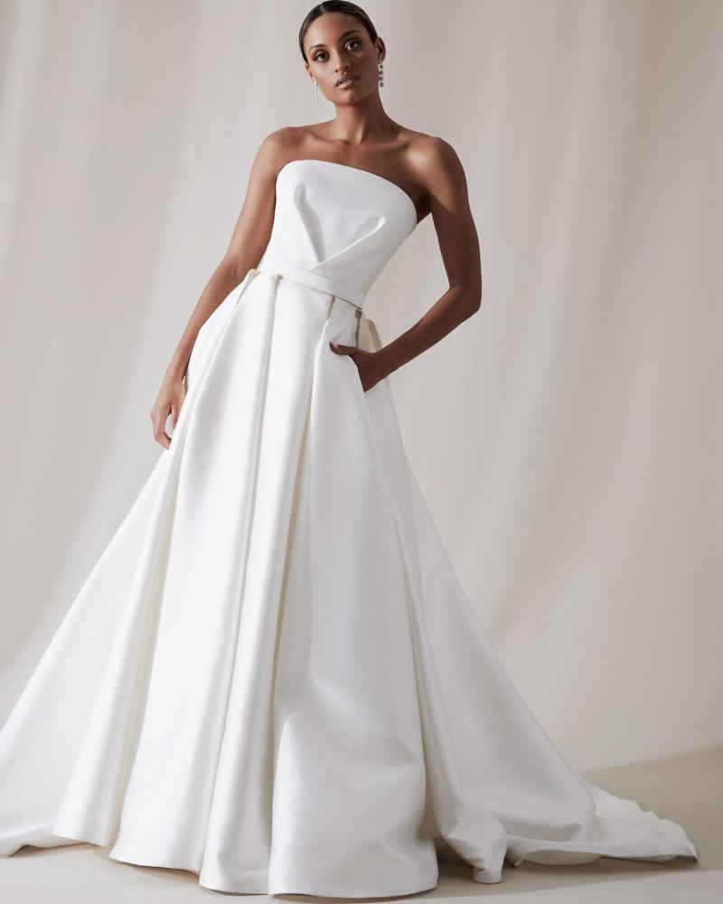 The Jacqueline Melanie by Karen Willis Holmes, a simple strapless A-Line wedding dress bodice with a straight across neckline.