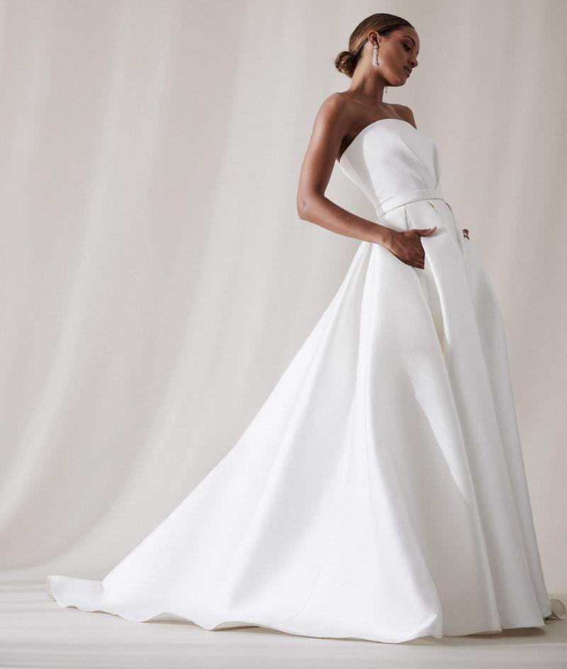The Jacqueline Melanie by Karen Willis Holmes, a simple strapless A-Line wedding dress bodice with a straight across neckline.