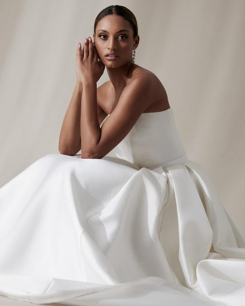 The Jacqueline Melanie by Karen Willis Holmes, a simple strapless A-Line wedding dress bodice with a straight across neckline.