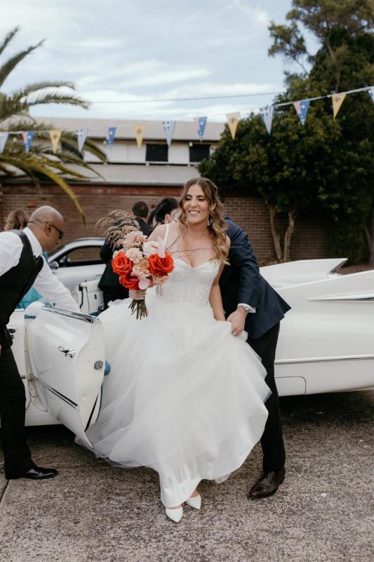 Real bride Gaby arriving to her wedding in the Scarlett gown; a strapless corset wedding dress by Karen Willis Holmes.