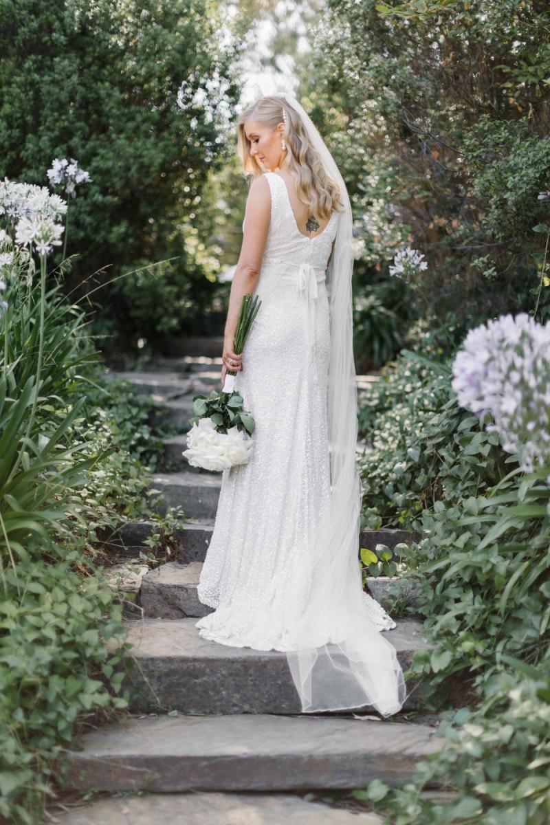 KWH real bride Bec stands in her gorgeous beaded Olympia gown with scoop back.