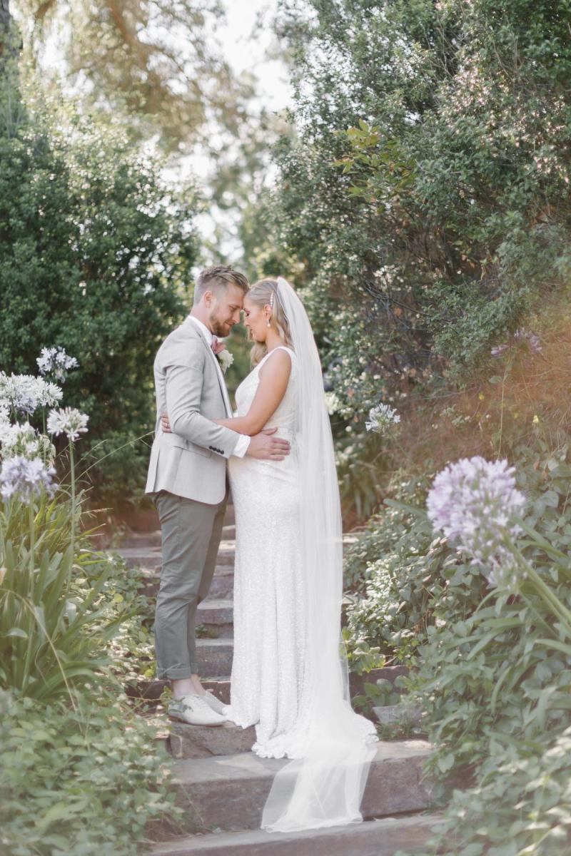 KWH real bride Bec stands in her gorgeous beaded Olympia gown with scoop back.