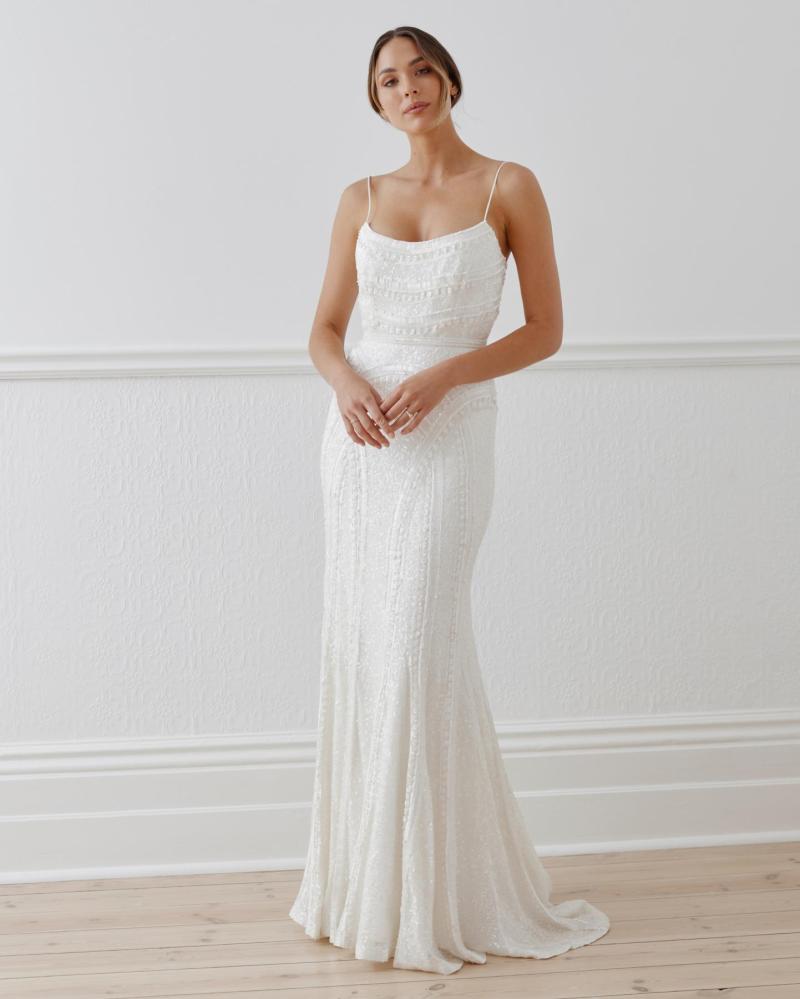 The Isabelle gown by Karen Willis Holmes, a unique spaghetti strap beaded wedding dress with a fit and flare shape.