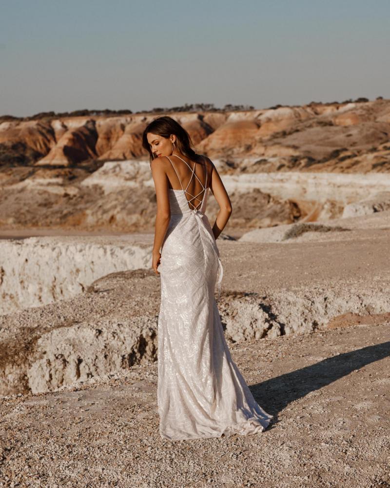 The Ellie gown by Karen Willis Holmes, a V-Neck open back, beaded fit and flare wedding dress.