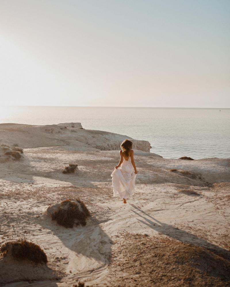 The Ellie gown by Karen Willis Holmes, a V-Neck open back, beaded fit and flare wedding dress.