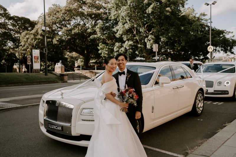 KWH real bride Sarah stands in her Bespoke Kitty Joni gown with sweet heart neckline and tulle skirt.