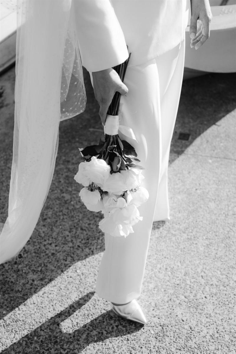 KWH real bride Demi's bridal bouquet by The Curated Life. She wears the modern tailored Charlie Jacket Danielle Pant bridal suit to her elopement.