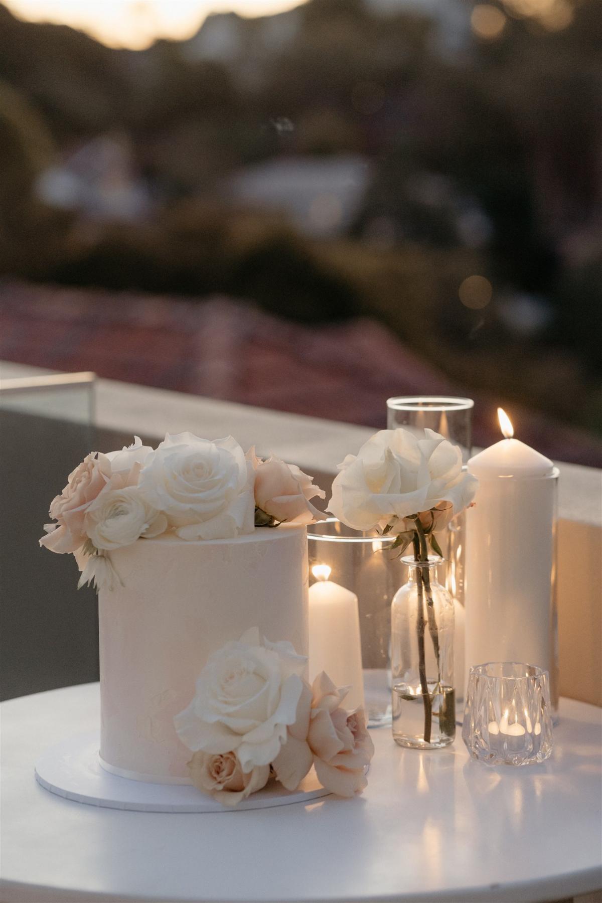 KWH real bride Demi's single tier wedding cake with white and blush roses for her small modern elopement.