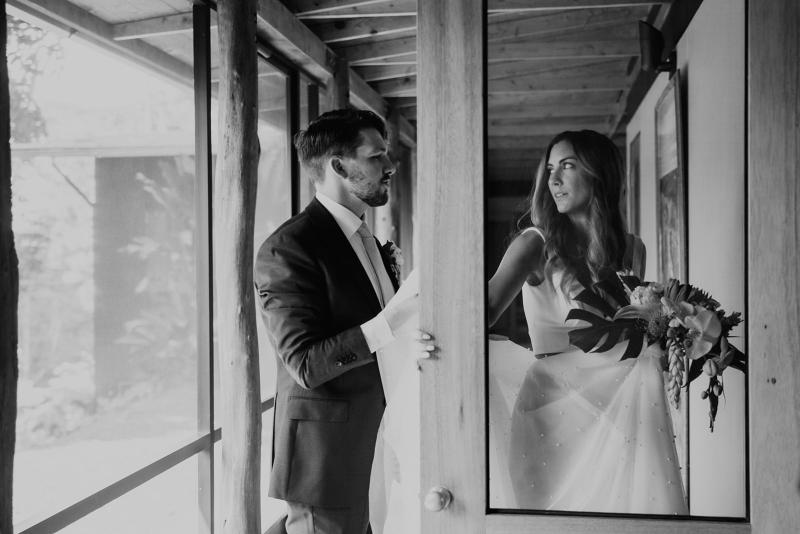 B&W image of KWH real bride Jana's Erin and Lea bridal set hanging in the window.